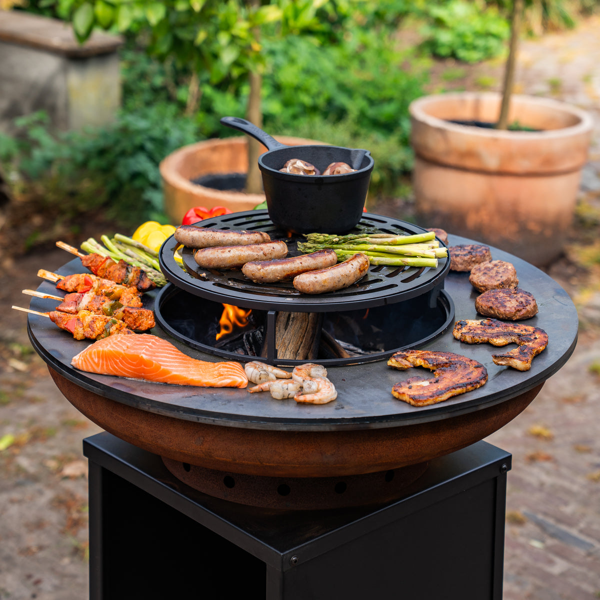 Barbacoa Plancha Grill Acero Corten Blackline 8mm Camarada 2.0 - Con atizador y leñero Ø70cm