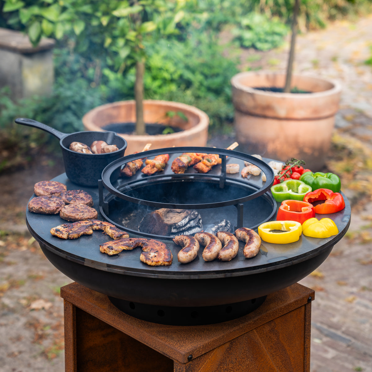 Barbacoa Plancha Grill Blackline Acero Corten 8mm Camarada 2.0 - Con atizador y leñero Ø70cm