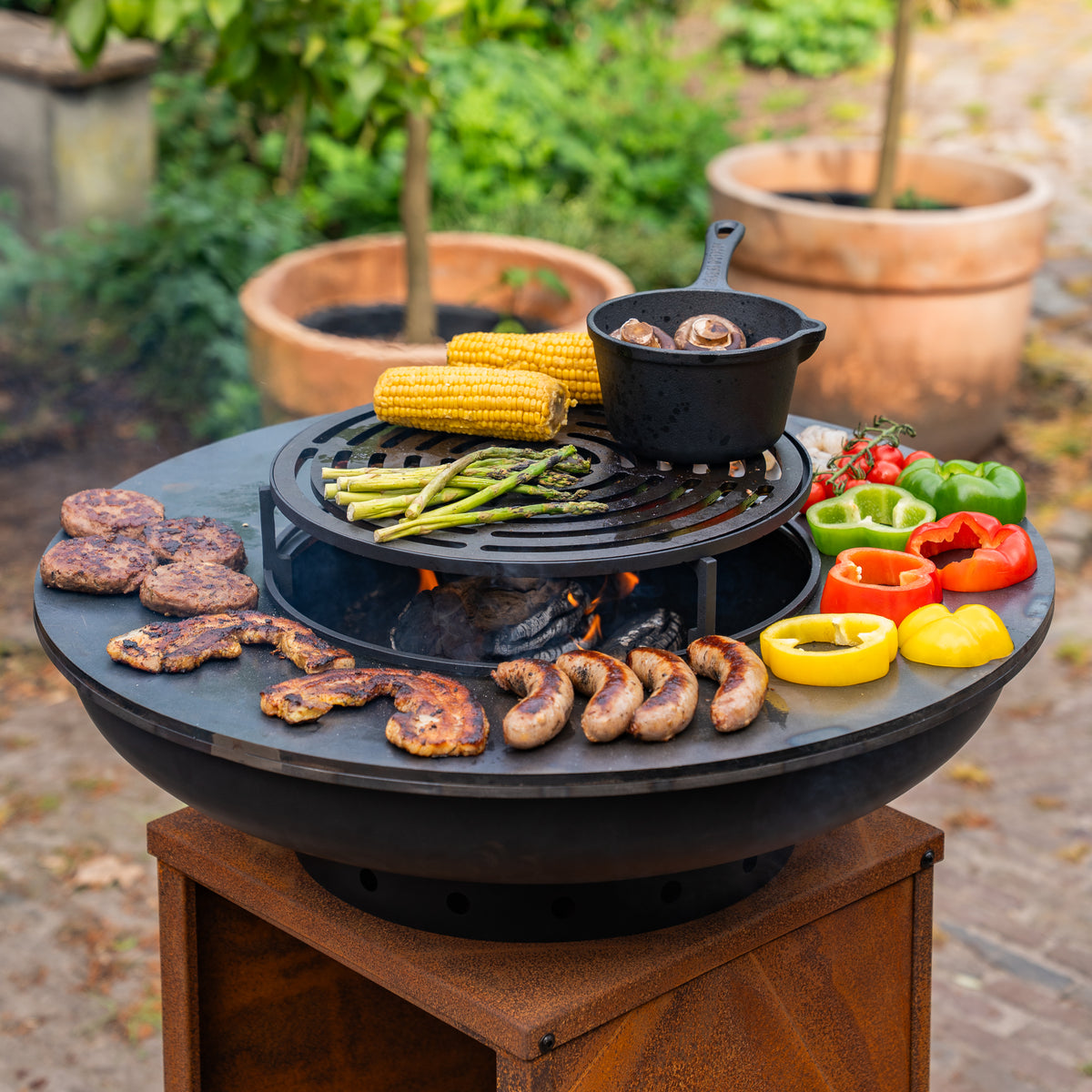 Barbacoa Plancha Grill Blackline Acero Corten 8mm Camarada 2.0 - Con atizador y leñero Ø70cm