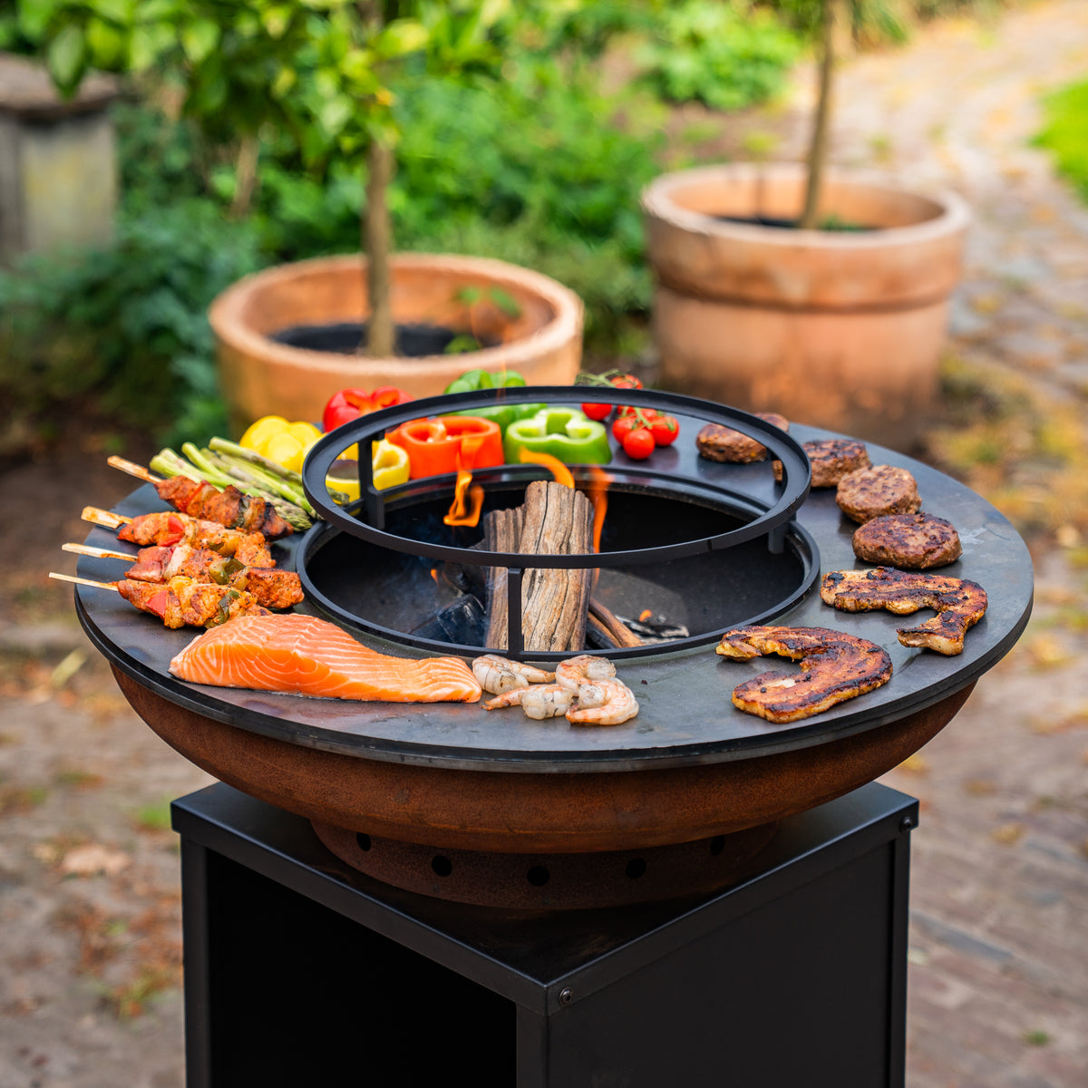 Barbacoa Plancha Grill Acero Corten Blackline 8mm Camarada 2.0 - Con atizador y leñero Ø70cm