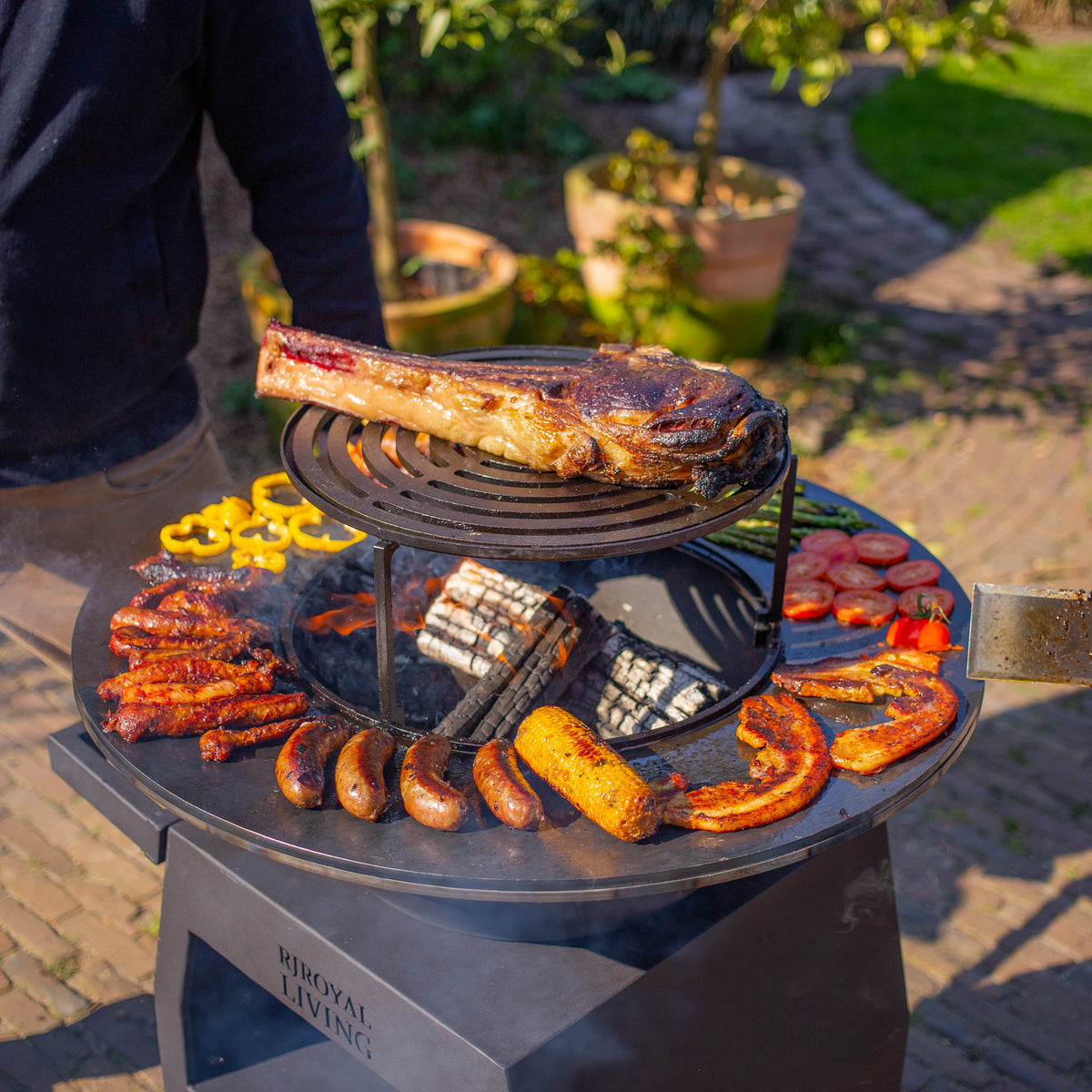 BBQ Plancha Grill Maestro Ø70cm Blackline - Con ruedas grandes y almacén de leña