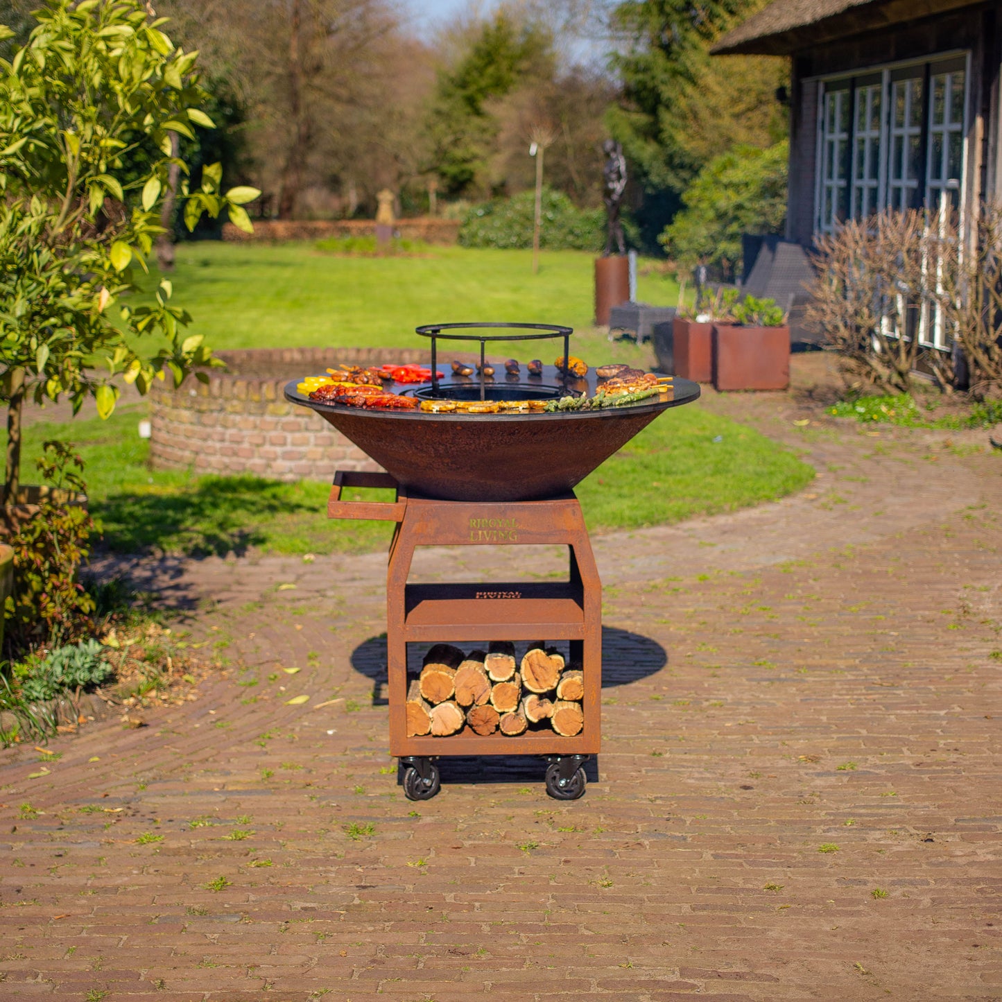 Barbacoa Plancha Grill Maestro XXXL Ø100cm Acero Corten - Con ruedas grandes y almacén de leña