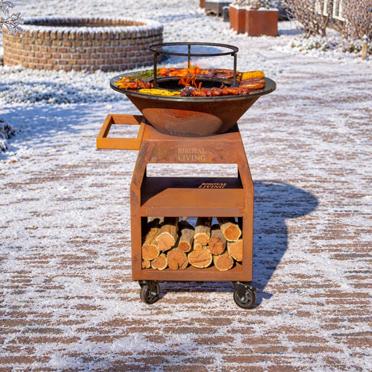 BBQ Plancha Grill Maestro Ø70cm Acero Corten - Con ruedas grandes y almacenamiento de leña